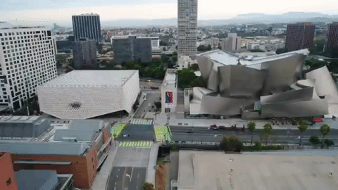 Downtown Los Angeles traffic moving through the city at dusk
